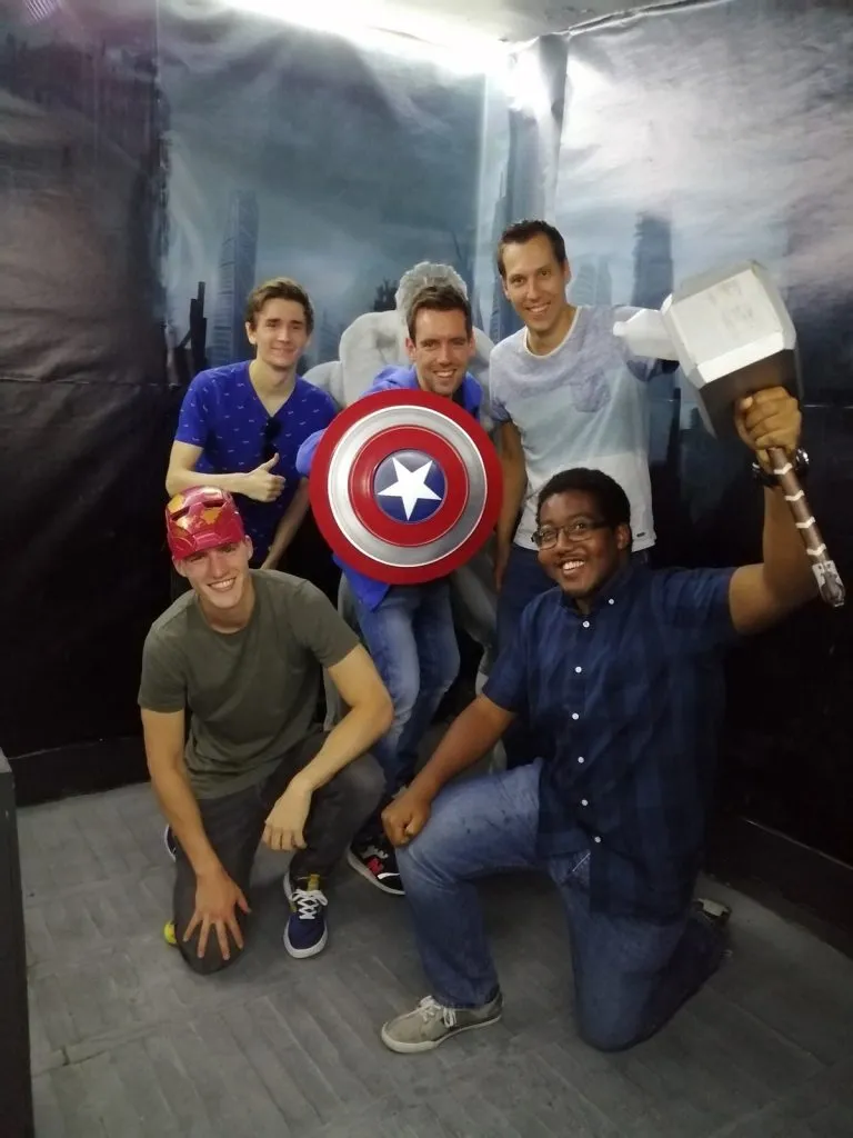 Team with the hero's shield in the Avengers superhero escape room in Budapest